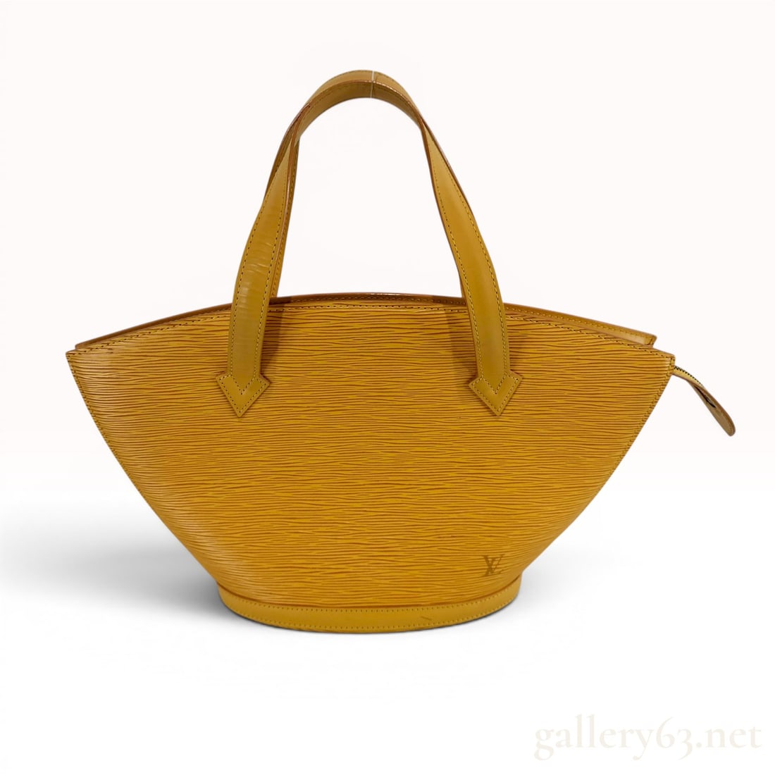 Louis Vuitton Yellow Epi Leather Saint Jacques Shopping Tote Bag: This Louis Vuitton Saint Jacques Shopping Tote is a large-sized shoulder bag crafted from signature Tassil Yellow Epi leather. The bag features a structured, fan-shaped silhouette that tapers from a