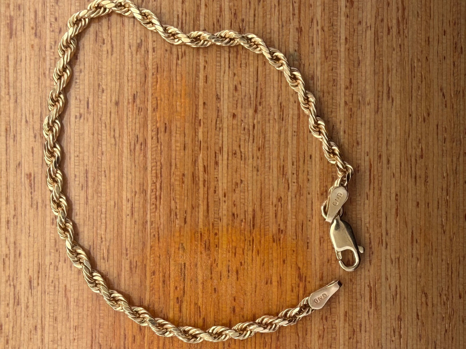 10K Yellow Gold Rope Bracelet: 6.5â€? long 1.6 grams 1.6 grams