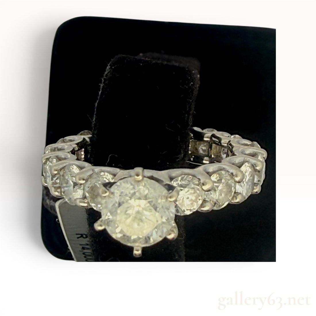 4.78cttw Diamond Ring: Features a 1.03 carat center stone with 3.75 carats of side diamonds. Size 6.5 and weighs 5.7 grams. 5.7 grams