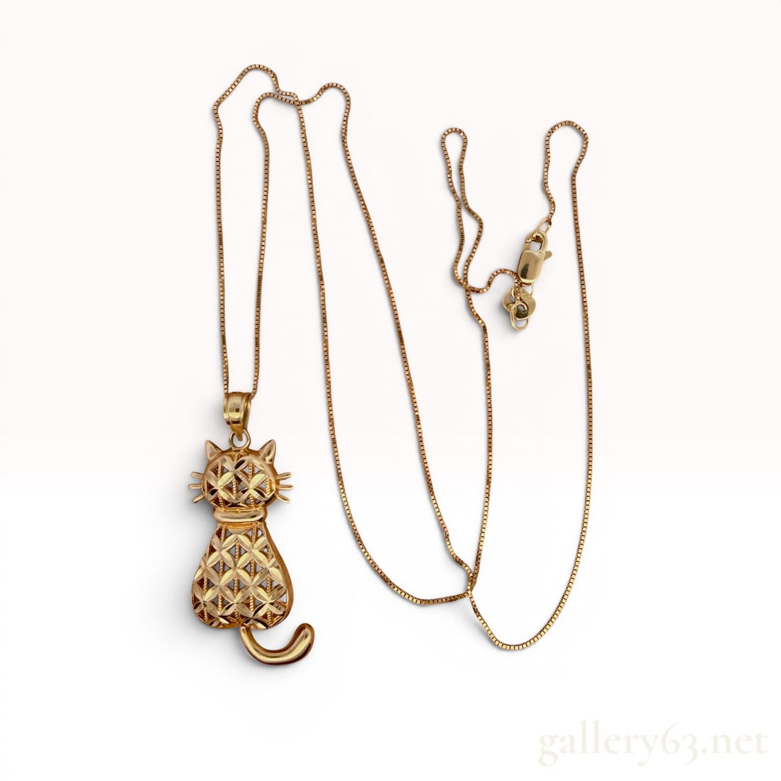 14K Yellow Gold Cat Necklace: Measures 18" long and weighs 2.5 grams. 2.5 grams