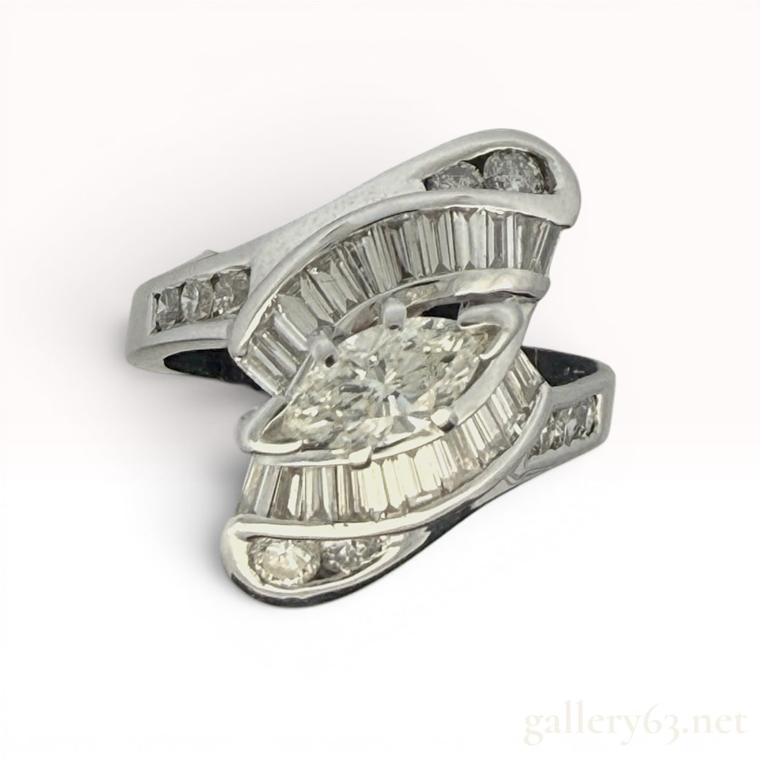 14K Gold 1.65cttw Diamond Ring: Features a 0.60 carat center stone with 1.65cttw total. Size 6.5 and weighs 7.4 grams. 7.4 grams