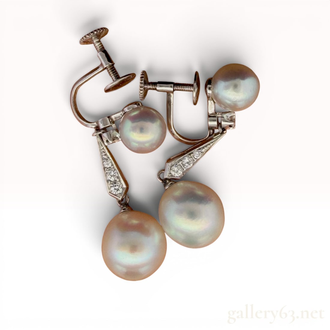 14K White Gold Diamond and Pearl Earrings: Feature 0.15 carats of diamonds and weigh 7.7 grams. 7.7 grams