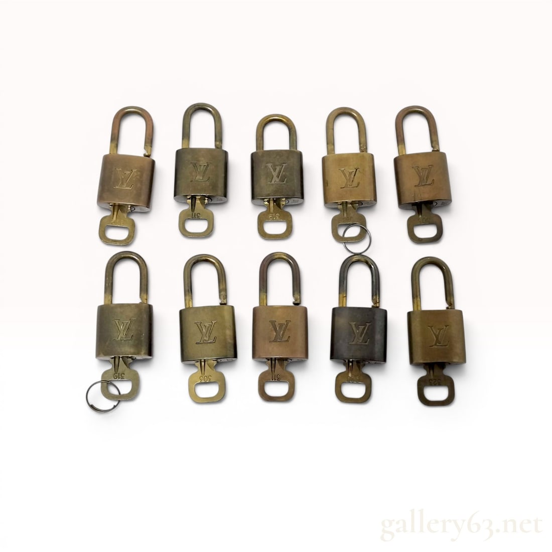 Lot of 10 Louis Vuitton Brass Padlocks with Matching Keys: This lot consists of 10 Louis Vuitton brass padlocks, each accompanied by a single matching key. These iconic luggage accessories were designed for use with the manufacturer's travel bags and handbags