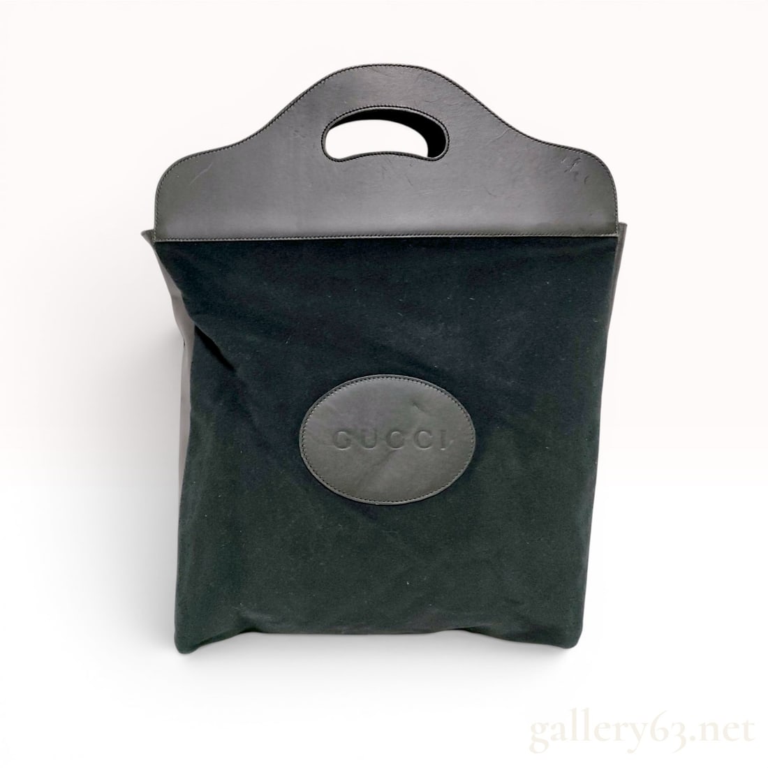 Vintage Gucci Black Suede and Leather Top Handle Tote Bag: A vintage Gucci tote bag featuring an unstructured black suede body and integrated, arched smooth black leather handles. The top portion of the bag is constructed from two smooth leather panels with c