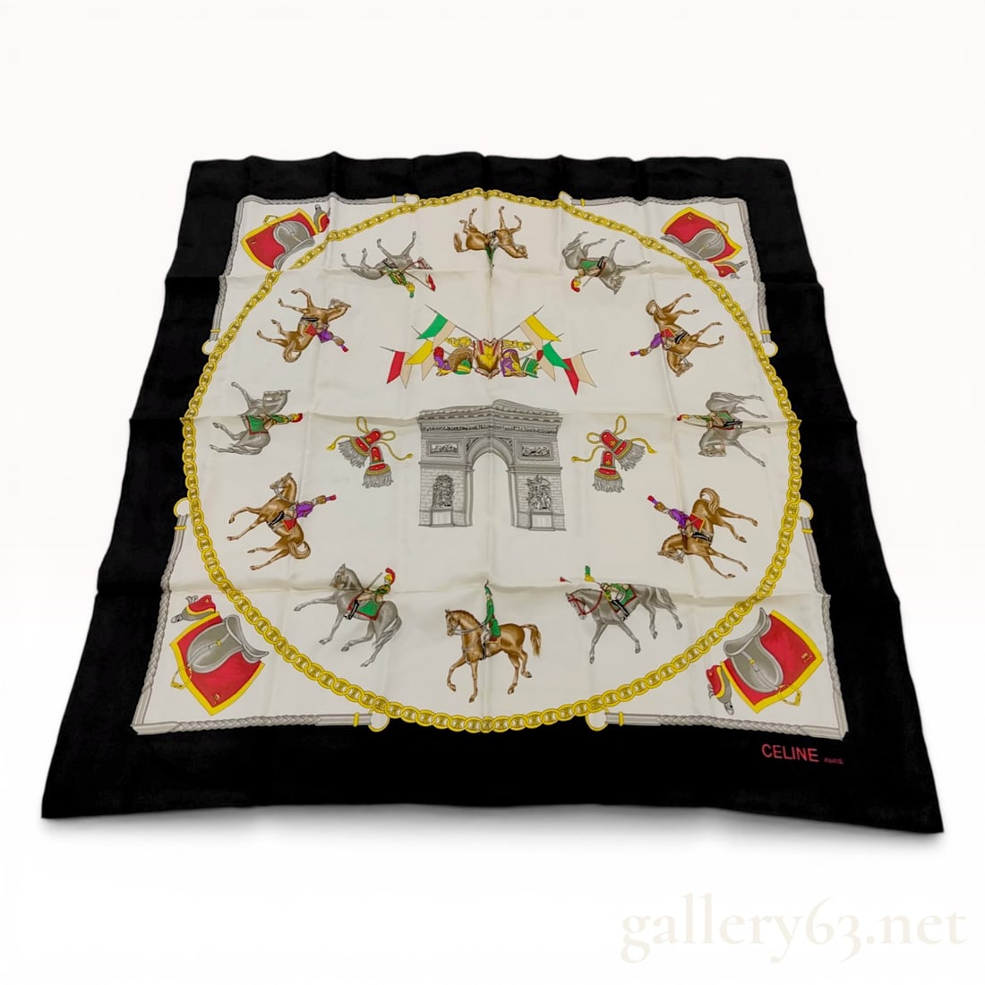 Celine Silk Scarf with Equestrian and Arc de Triomphe Motif: Celine silk scarf featuring an equestrian theme centered on a monochromatic illustration of the Arc de Triomphe. The composition includes horse and rider motifs in military attire, corner saddle image
