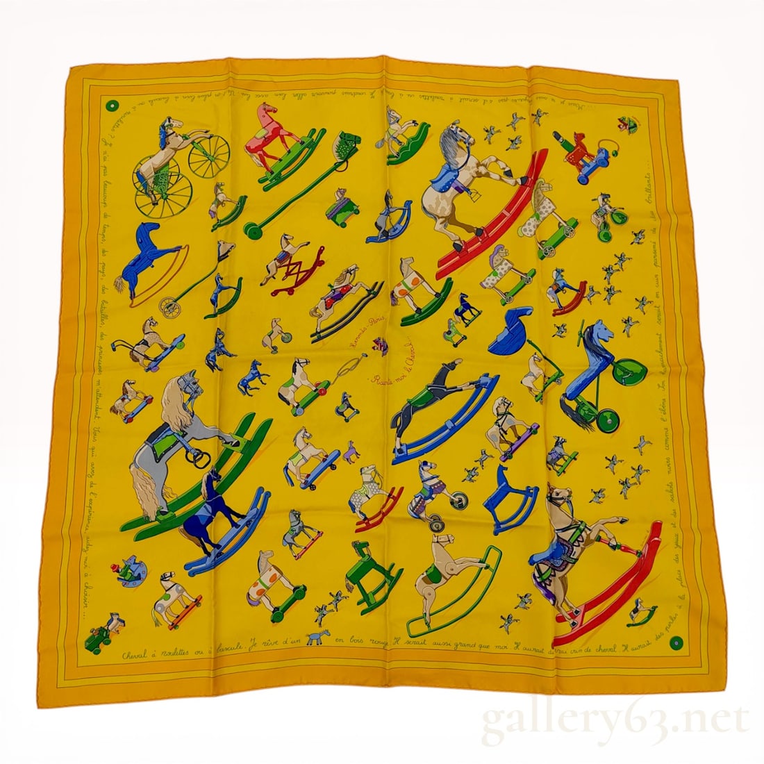 Hermes Raconte-moi le Cheval Silk Carre 90 Scarf: Herm s silk Carr 90 scarf in the Raconte-moi le Cheval pattern designed by Dimitri Rybaltchenko. The composition features various antique-style rocking horses and wheeled toys on a yellow ground with 