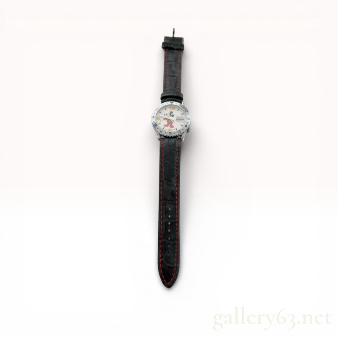 Seiko Mickey Mouse Automatic Wristwatch Reference 6309-8820: Seiko Mickey Mouse automatic wristwatch, reference 6309-8820. The stainless steel case features a rotating bezel and a white dial with a central Mickey Mouse illustration, yellow Arabic numerals, and 