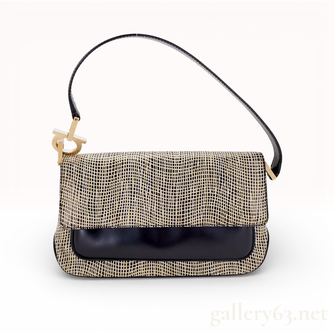Salvatore Ferragamo Gancini Shoulder Bag: Salvatore Ferragamo Gancini shoulder bag crafted from smooth black leather and a textured black and cream grid-patterned material. The design features a front flap closure and a single black leather s