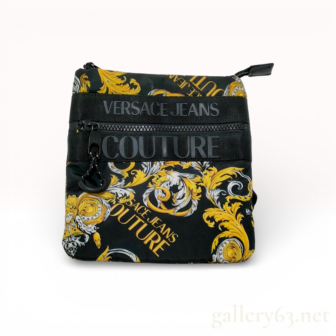 Versace Jeans Couture Baroque Print Nylon Crossbody Messenger Bag: Versace Jeans Couture small crossbody messenger bag featuring a signature yellow and white baroque pattern on a black ground. Constructed from technical nylon fabric with synthetic trim, the bag inclu