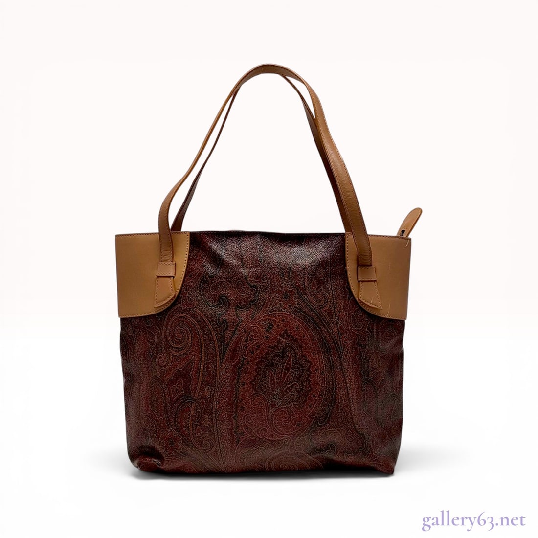 Etro Paisley Printed Coated Canvas Tote Bag: Etro tote bag featuring the signature multicolored paisley print on coated canvas with tan leather trim. The bag is designed with dual flat leather shoulder straps and a top zipper closure opening to 