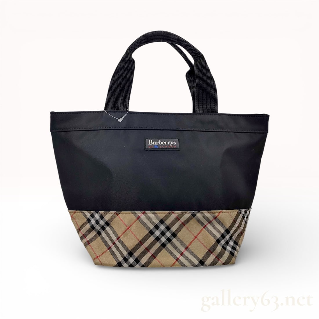 Burberrys Vintage Small Bi-color Tote Bag Nylon and Nova Check Canvas Black: This vintage Burberrys small tote bag features a classic bi-color design, combining a durable black nylon upper with a signature beige Nova Check canvas bottom panel. The front is adorned with a recta