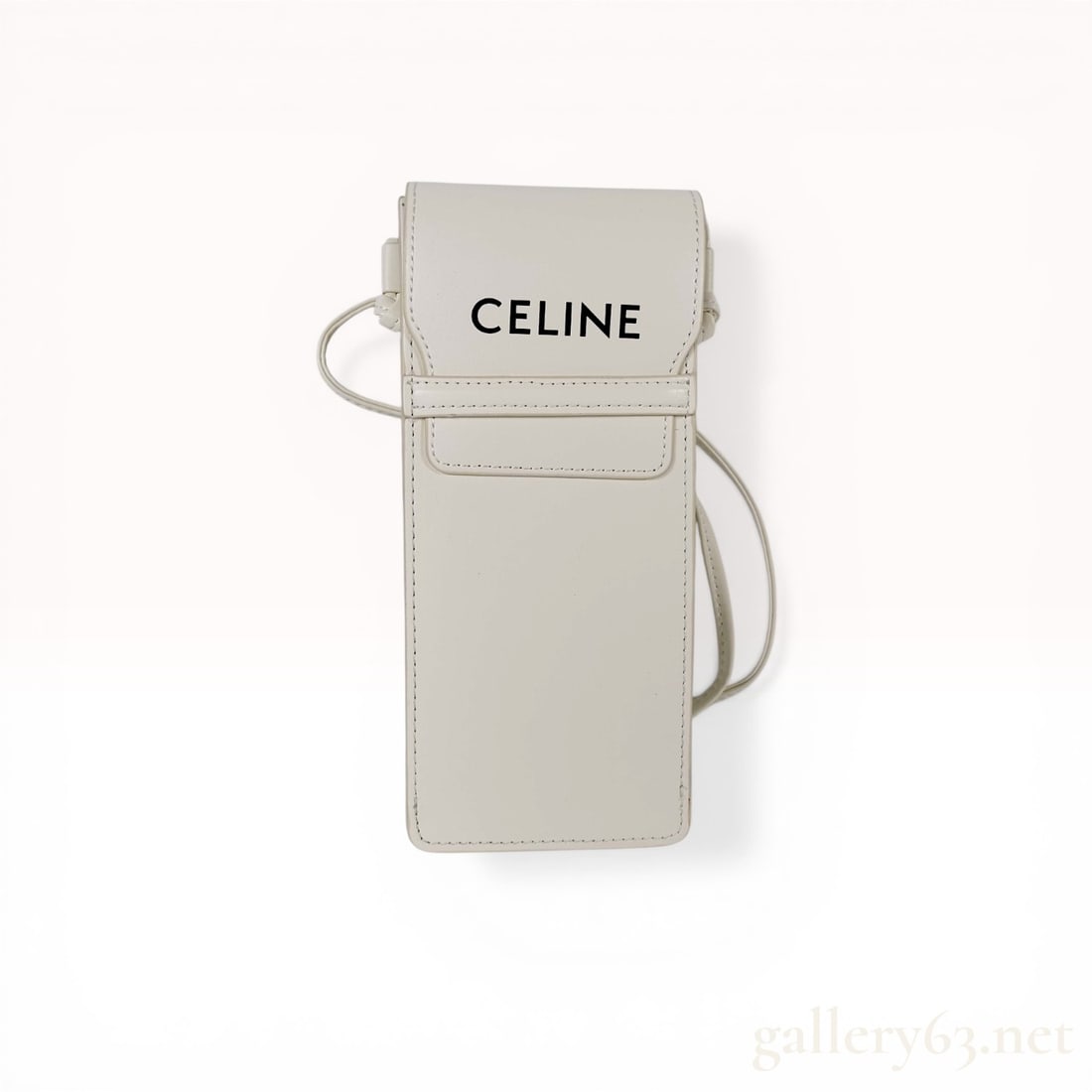 Celine Smooth Calfskin Flap Phone Pouch with Strap: Celine vertical flap phone pouch in off-white smooth calfskin leather. The minimalist rectangular accessory features a fixed thin leather shoulder strap and a black textile-lined interior. The front f