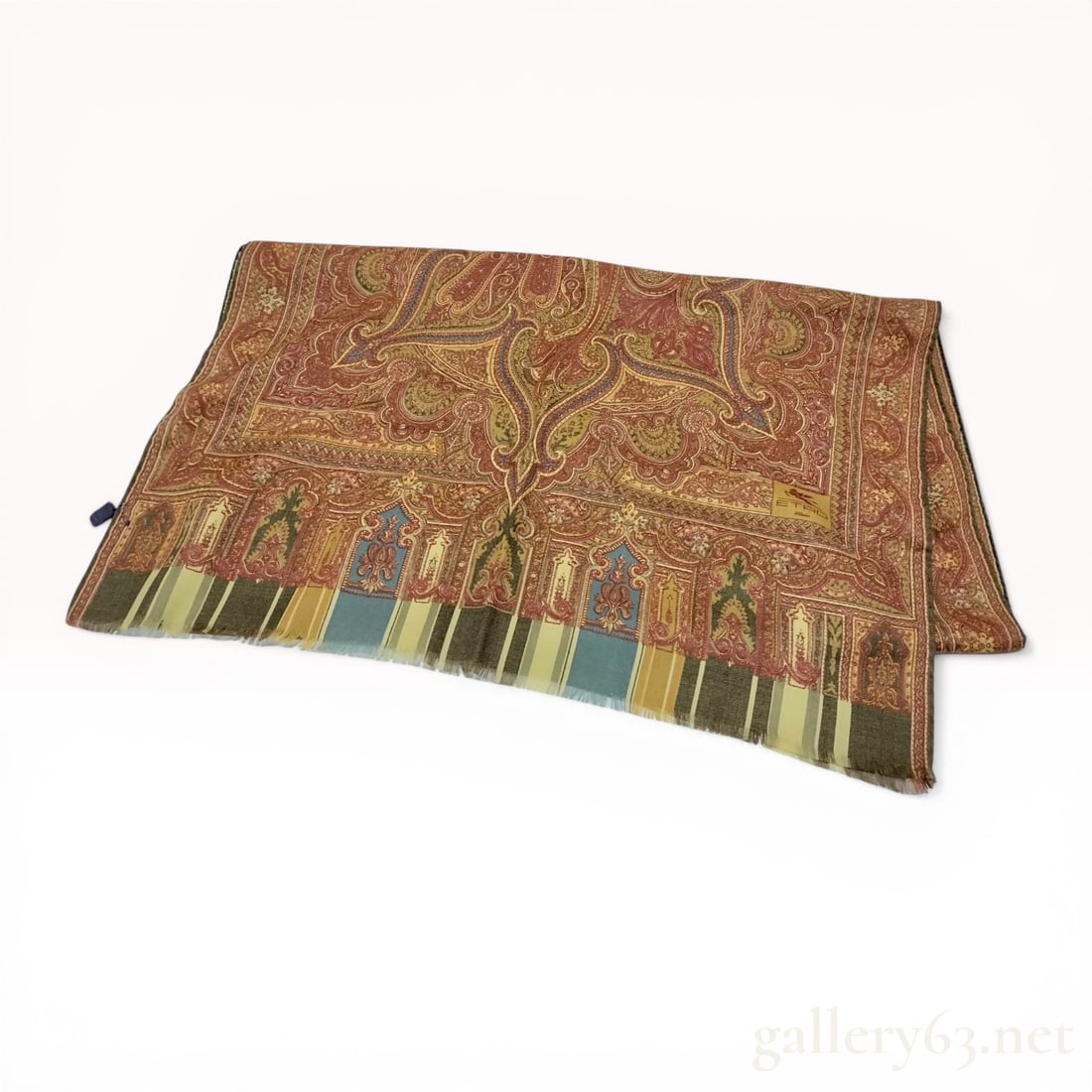 Etro Milano Wool Paisley Scarf: Etro Milano wool scarf featuring an intricate paisley and foliate pattern in a warm palette of red, rust, olive green, and tan with blue accents. Constructed from 100% wool with a multi-colored stripe