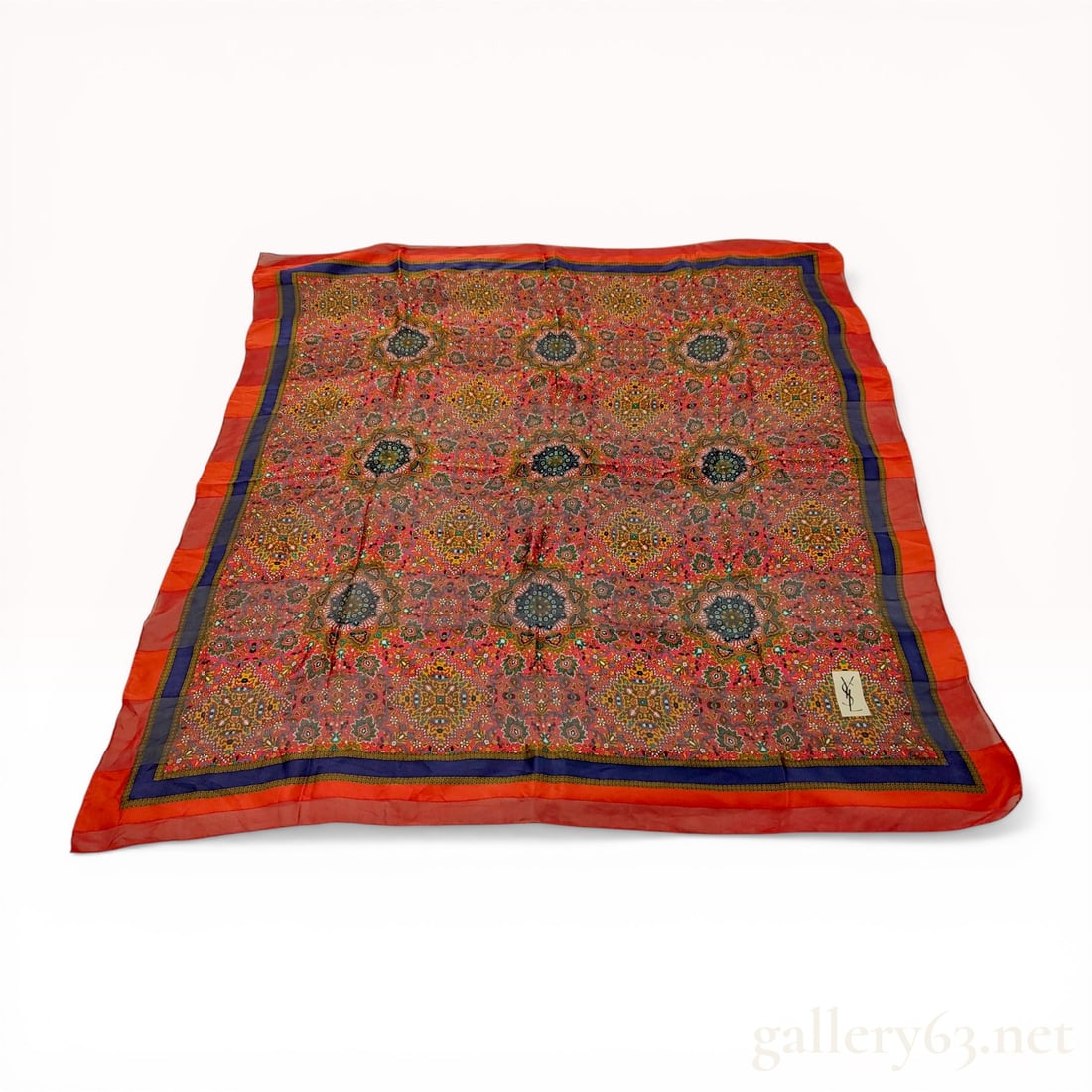 Yves Saint Laurent Large Medallion Print Silk Scarf: Vintage Yves Saint Laurent large square scarf in sheer silk. Features an all-over floral pattern with nine central medallions, a navy blue inner border, and a wide red outer border. Finished with hand