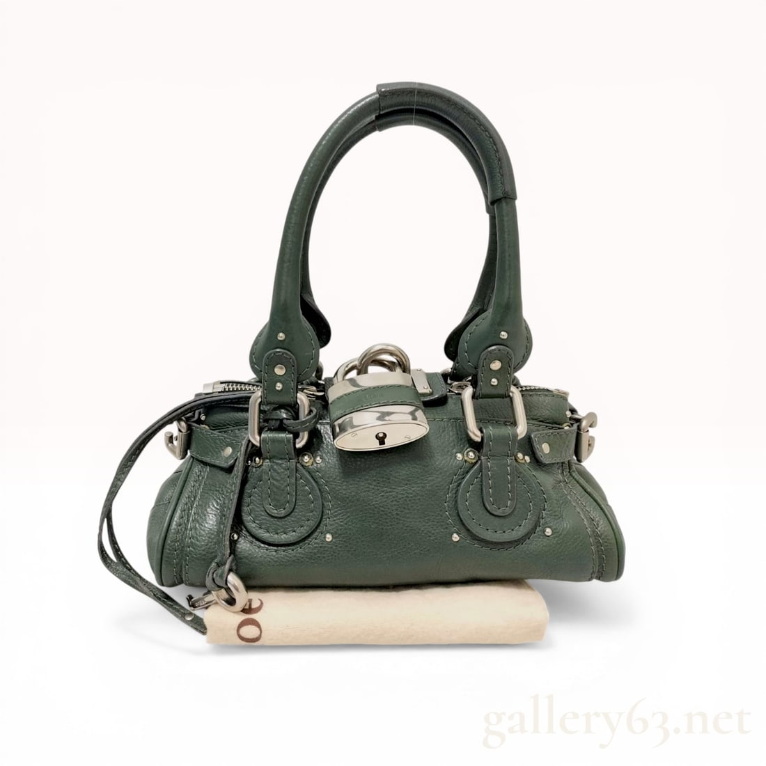 Chloe Forest Green Grained Leather Paddington Satchel: Chloe Paddington satchel crafted from forest green grained calfskin leather with silver-tone hardware. The bag features dual rolled leather handles, a two-way top zip closure, and the signature oversi