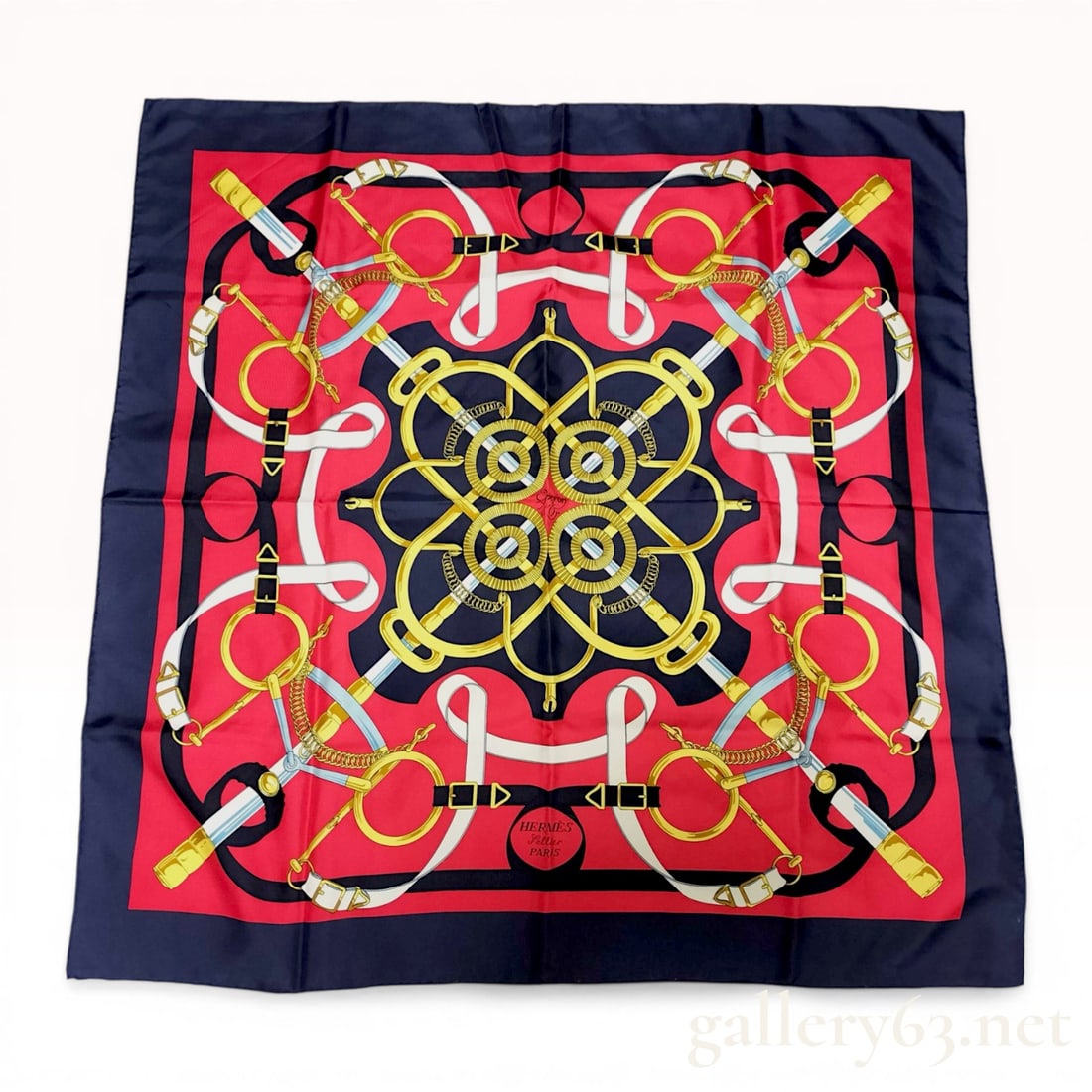 Herm?¨s Eperon d'Or Silk Scarf: Hermès silk carré in the Éperon d'Or pattern, originally designed by Henri d'Origny in 1974. The equestrian motif features interlaced spurs, leather straps, and metal hardware in 
