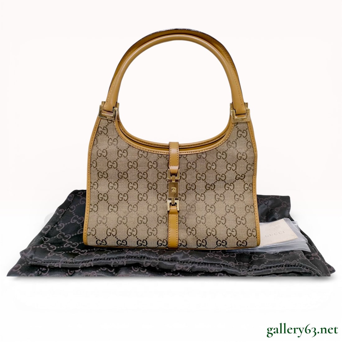 Gucci Jackie Bardot GG Supreme Canvas Shoulder Bag, Tan Leather: This Gucci Jackie Bardot shoulder bag is crafted from signature GG monogram canvas with smooth tan leather trim. The bag features a structured hobo silhouette secured by a gold-tone piston-lock closur