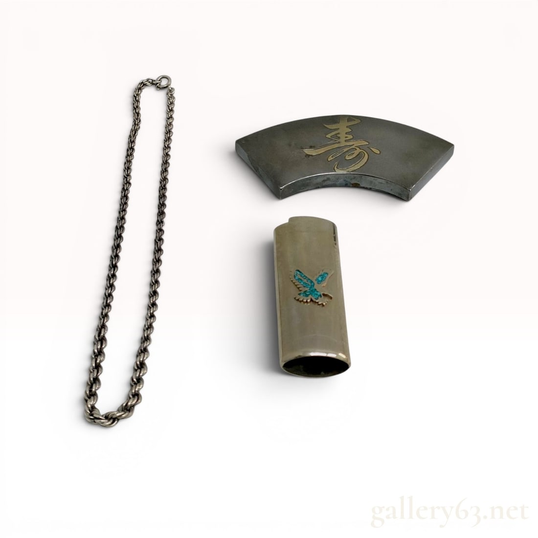 Three Sterling Silver Items including a Japanese Fan-Shaped Box and Southwest-Style Lighter Cover: Trio of silver-tone metal items featuring a mid-20th century Japanese fan-shaped lidded trinket box and a Southwest-style lighter sleeve. The fan box is decorated with a gold-tone kanji character &quo