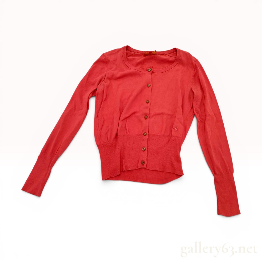 Vivienne Westwood Red Label Red Cotton Knit Orb Logo Cardigan Size 3: A button-front knit cardigan from the Vivienne Westwood Red Label line. The garment is crafted from 100 percent red cotton and features a classic round neckline with a cropped, fitted silhouette. Desi