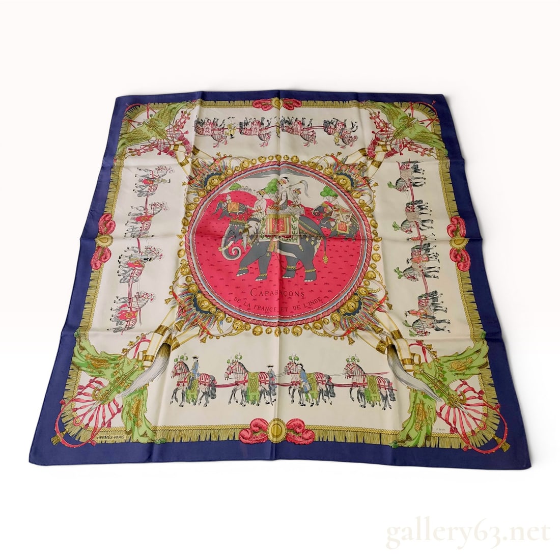 Herm?¨s Capara?§ons de la France et de l'Inde Silk Scarf: This 100% silk scarf from Hermès features the Caparaçons de la France et de l'Inde pattern, designed by Philippe Ledoux. The composition centers on a fuchsia pink circular medallion depi