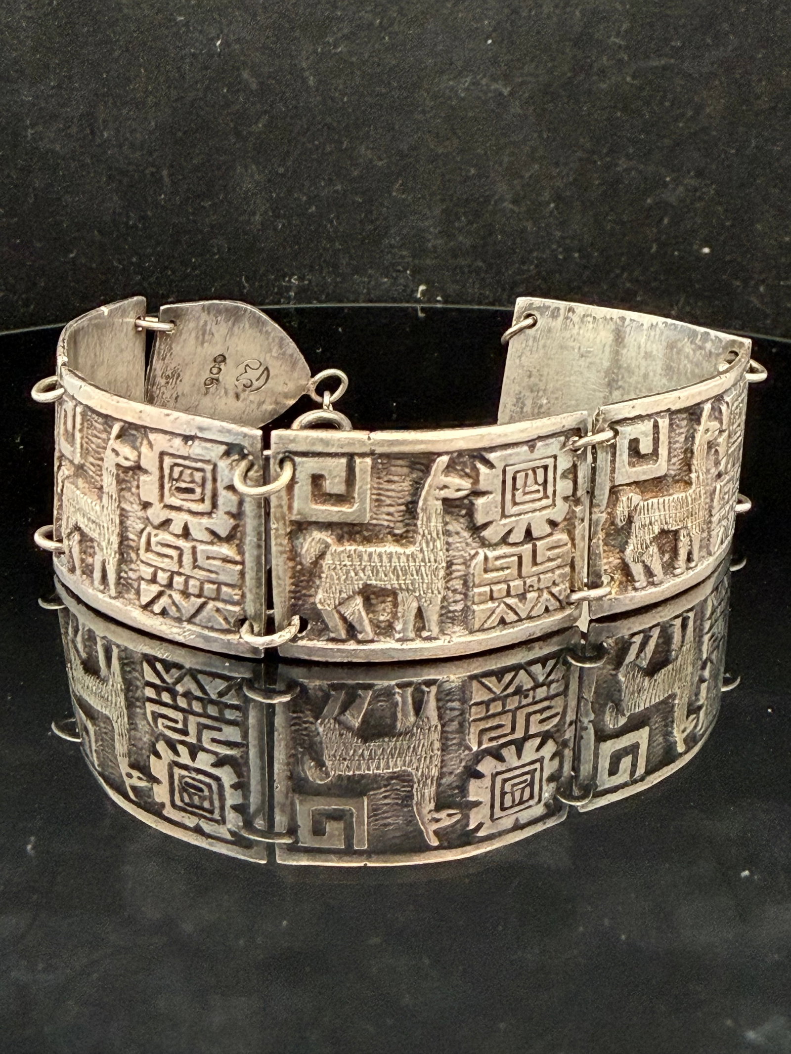 Peruvian .900 Silver Bracelet: Good estate condition 30.0 grams 7.5 inches long.