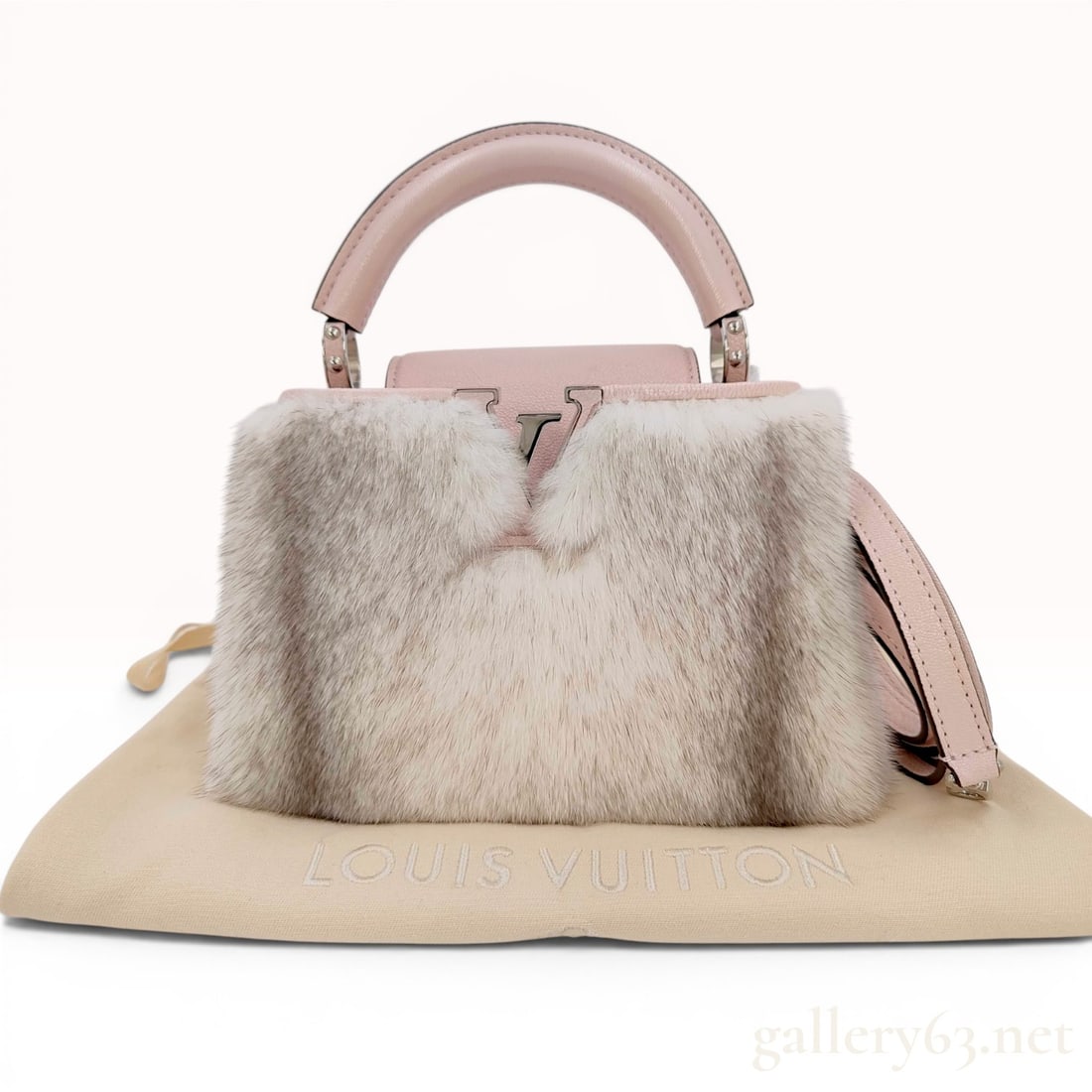 Louis Vuitton Mink Fur and Light Pink Taurillon Leather Capucines Mini 2-Way Handbag: A Louis Vuitton Capucines Mini handbag featuring light pink pebbled Taurillon leather and panels of white and grey mink fur. This model is constructed with a single rolled top handle and silver-tone h