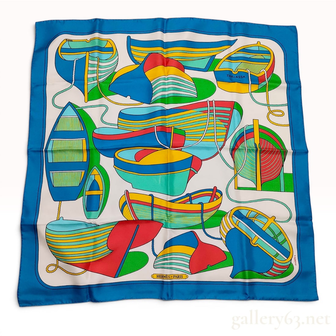 Hermes Paris Silk Scarf Thalassa Pattern by Pierre Peron: This is a vintage silk twill scarf from Hermes Paris featuring the Thalassa nautical design by artist Pierre Peron. The design depicts various colorful stylized boats, nautical ropes, and wave motifs.