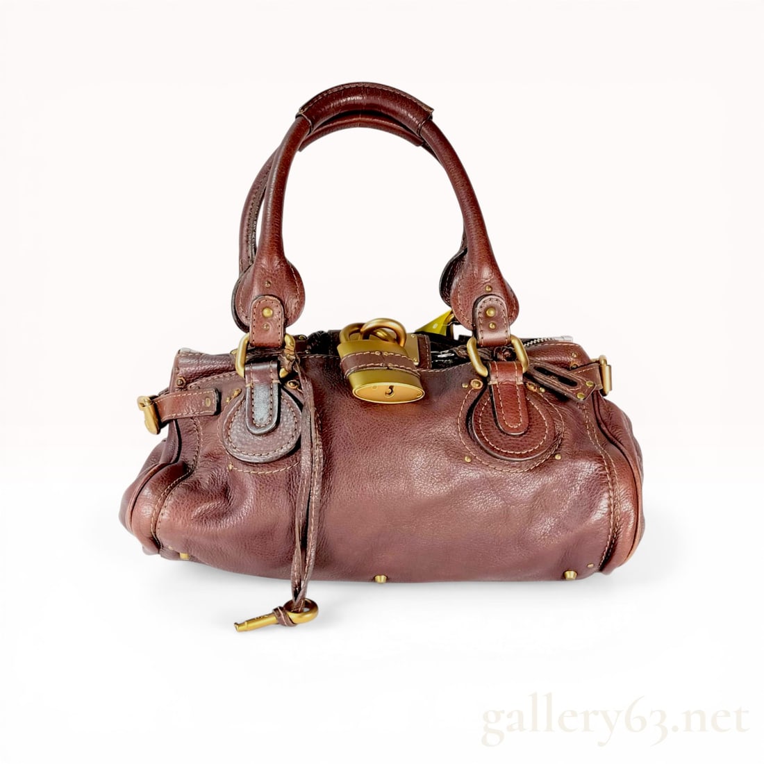 Chloe Paddington Grained Leather Satchel Bag: Chloe Paddington satchel in dark brown grained leather, circa mid-2000s. This slouchy bag features double-rolled handles, contrast cream topstitching, and a signature oversized antiqued brass-tone pad
