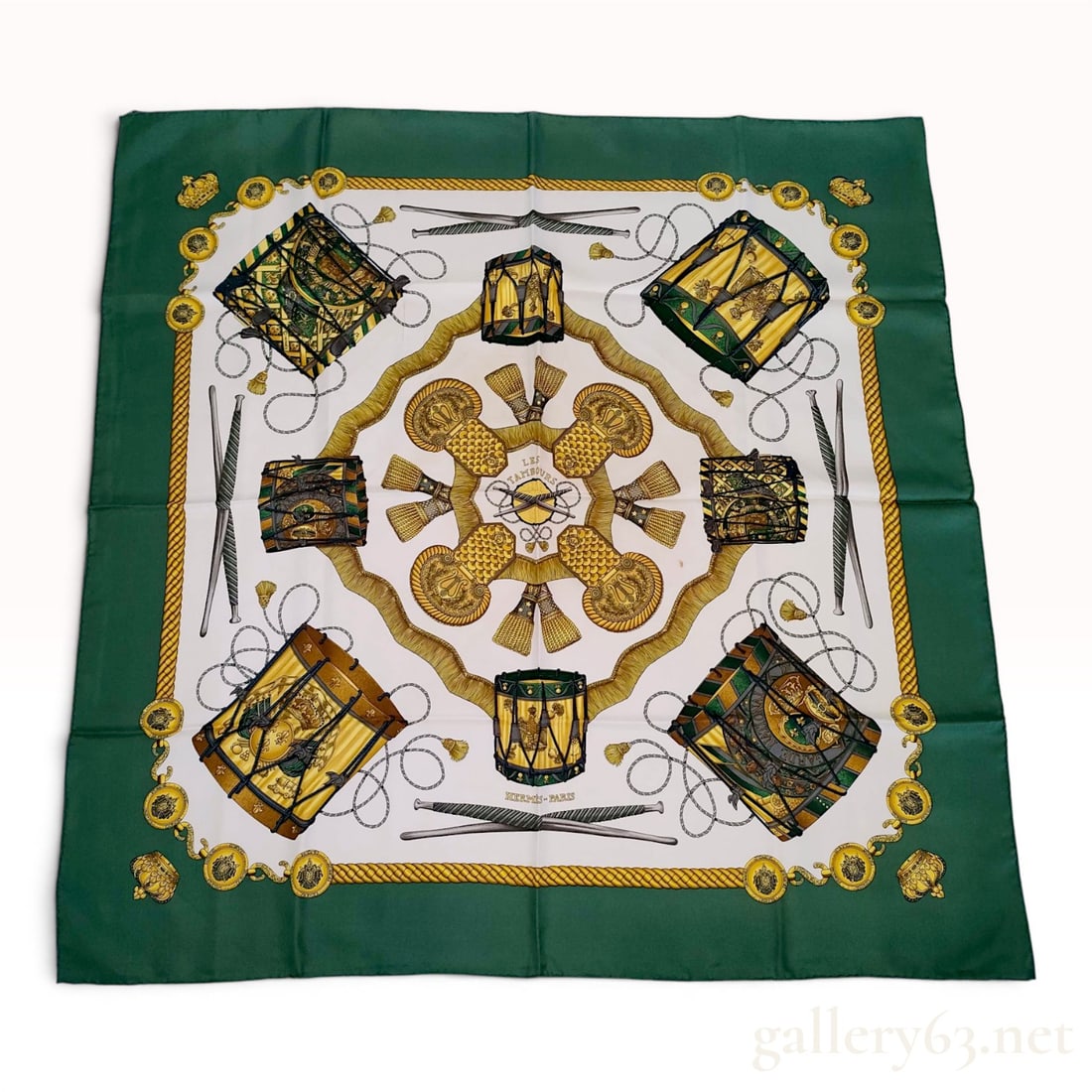 Hermes Joachim Metz Les Tambours Silk Carre 90 Scarf: An authentic Hermes silk scarf in the Carre 90 size, featuring the Les Tambours pattern designed by Joachim Metz. The design showcases a central medallion composed of military epaulettes and tassels, 