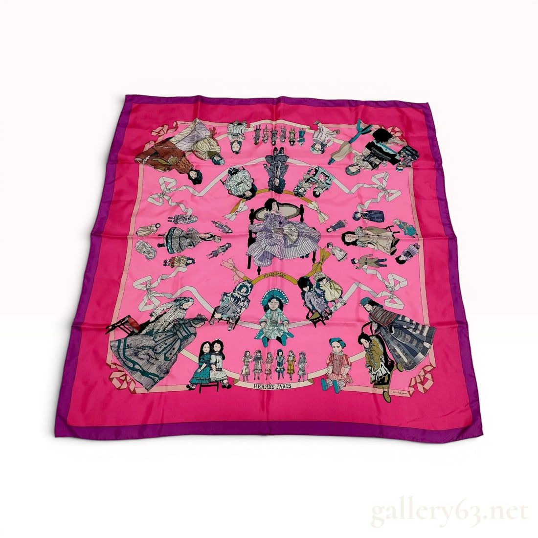 Hermes Hello Dolly Silk Scarf: This Hermes Paris silk scarf, titled Hello Dolly, was designed by artist Loic Dubigeon. The 100 percent silk scarf features a vibrant pink field framed by a deep purple border. The central design depi