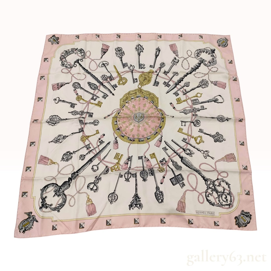 Hermes Paris Silk Carre 90 Scarf in Les Clefs Pattern: This scarf is produced by Hermes Paris and features the Les Clefs (The Keys) pattern, originally designed by Caty Latham. The composition consists of a central circular medallion in pink and gold, sur