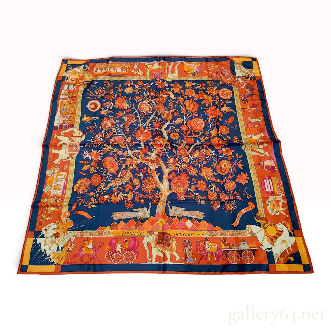 Hermes Silk Twill Carre 90 Scarf Fantaisies Indiennes: This is a 100 percent silk twill scarf from Hermes titled Fantaisies Indiennes, designed by artist Loic Dubigeon. The scarf features a complex Indian-themed illustration with a central Tree of Life mo