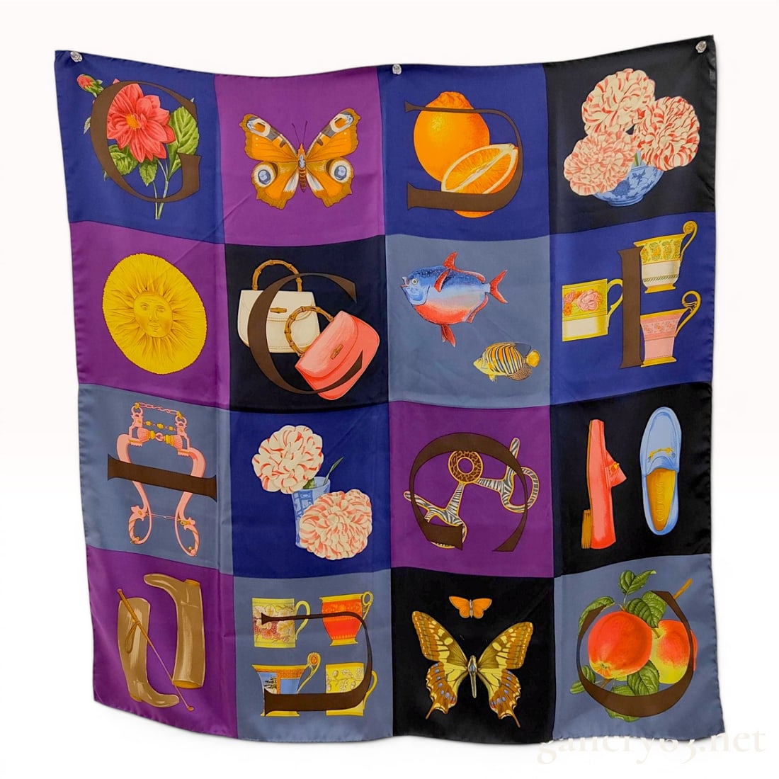 Gucci Icons and Nature Motifs Square Silk Scarf: Gucci square silk twill scarf featuring a 16-panel grid of iconic house motifs, late 20th century. Printed design includes bamboo-handle handbags, horse-bit hardware, and signature loafers alongside