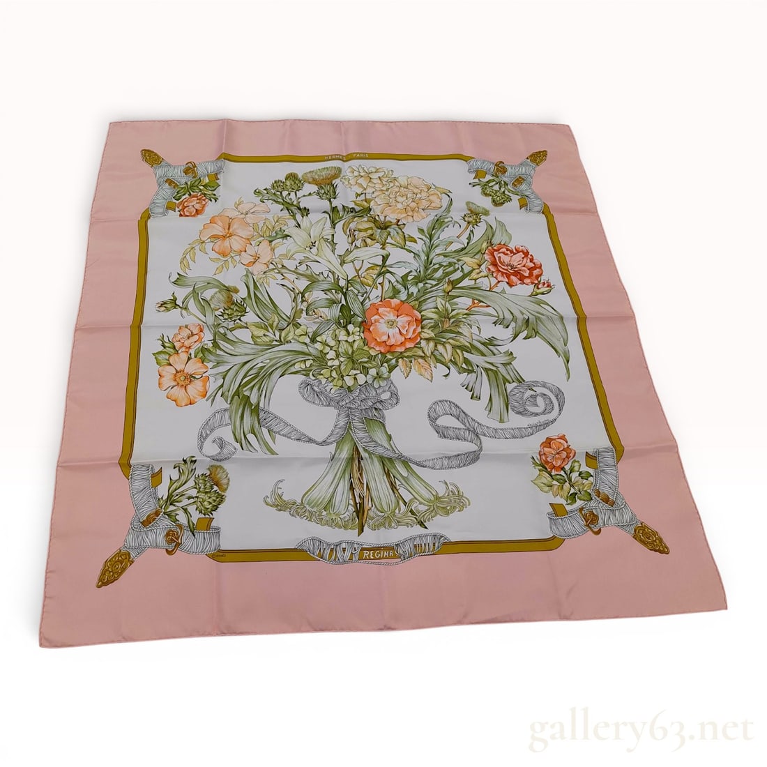 Hermes Regina Silk Scarf by Leila Menchari: An authentic Hermes silk scarf featuring the Regina pattern designed by Leila Menchari. The composition showcases a central, large bouquet of varied wildflowers and garden blooms, including lilies, po
