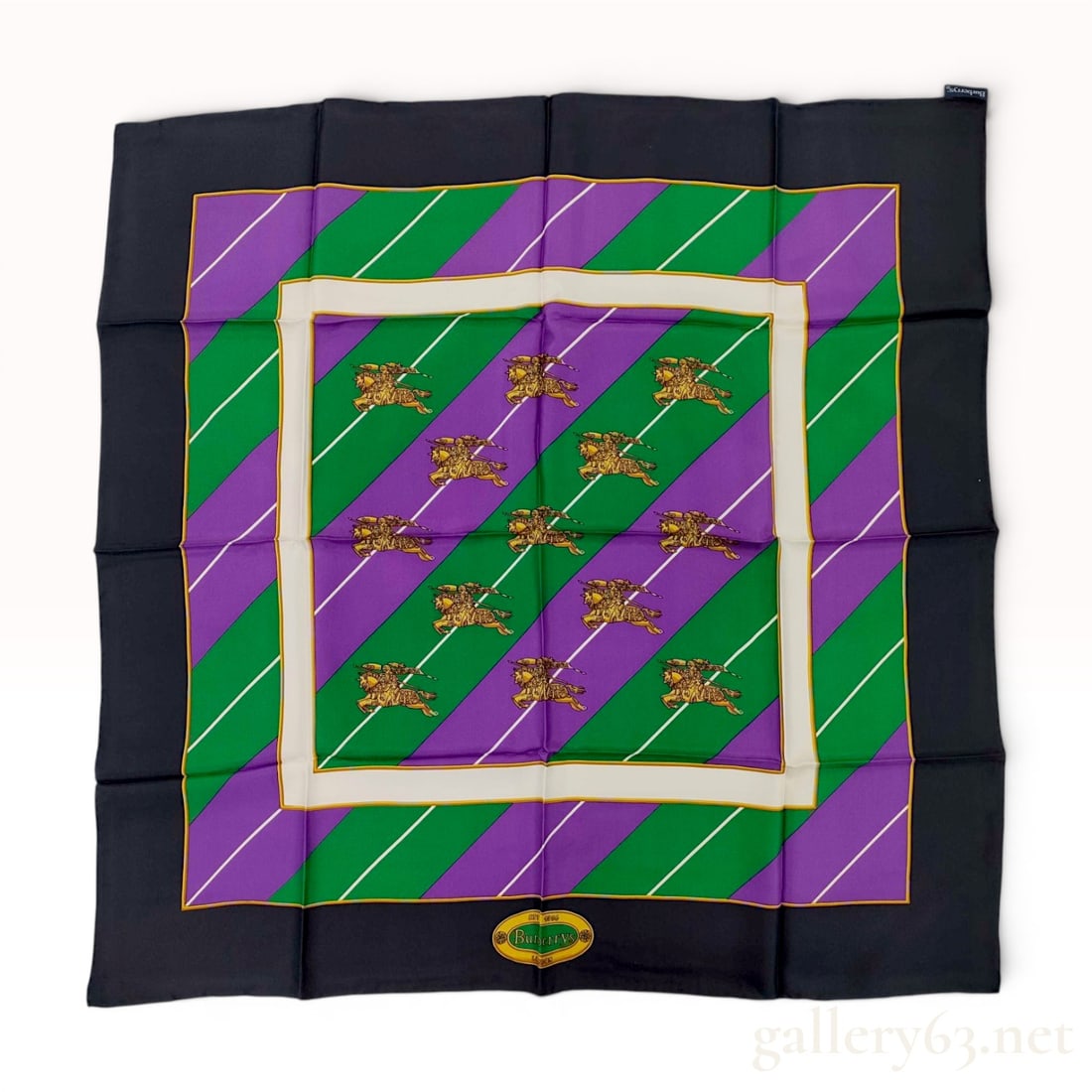 Vintage Burberrys' of London Striped Silk Scarf with Equestrian Knight Motif: Vintage Burberrys' of London square silk scarf, made in Italy. The design features a diagonal green and purple striped field accented with white pinstripes and repeating gold-tone equestrian knight mo