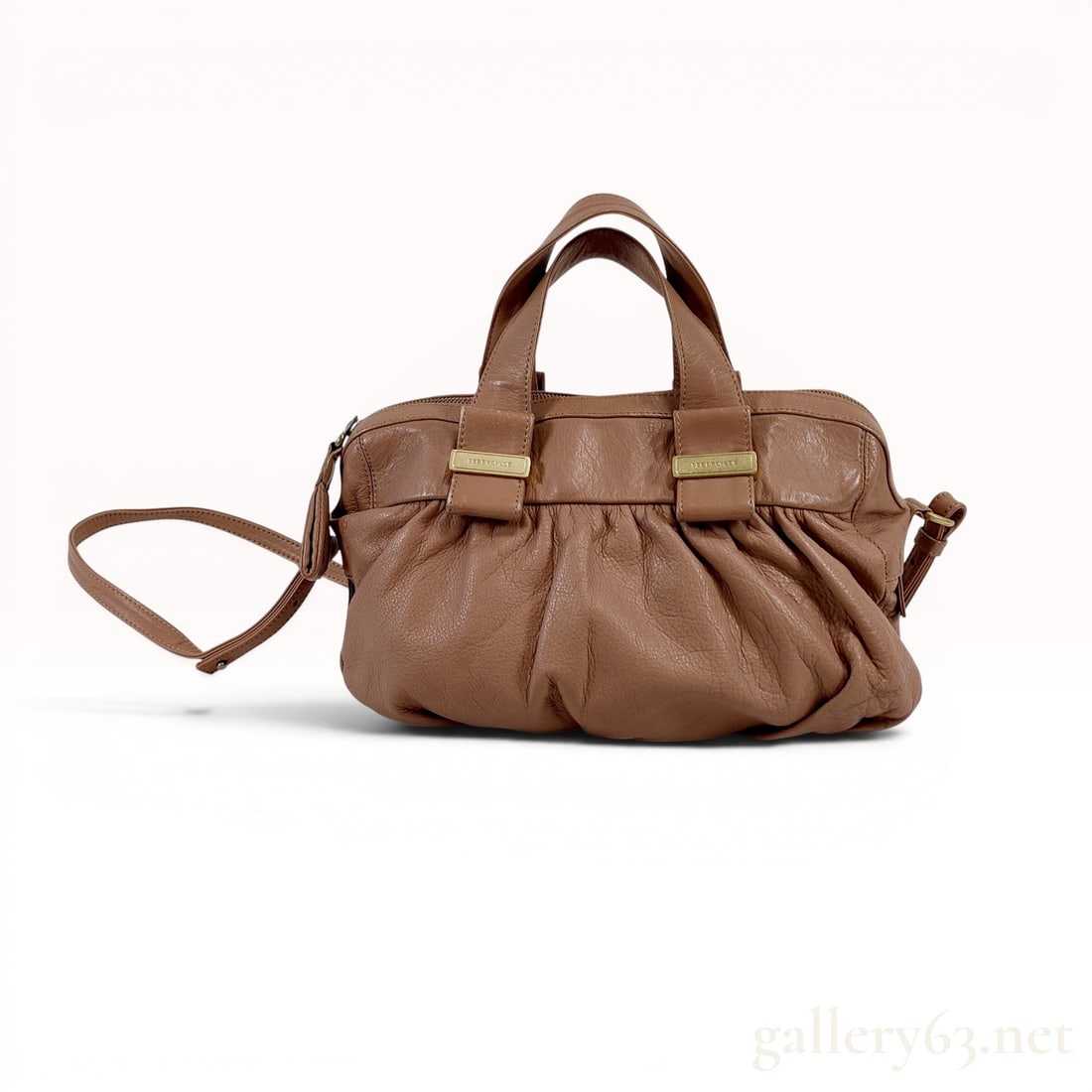 See By Chloe Tan Pebbled Leather Bow Satchel Bag: See By Chloe tan pebbled leather satchel featuring a gathered body and decorative front bows with branded gold-tone plates. The bag includes dual rolled top handles, a detachable adjustable shoulder s