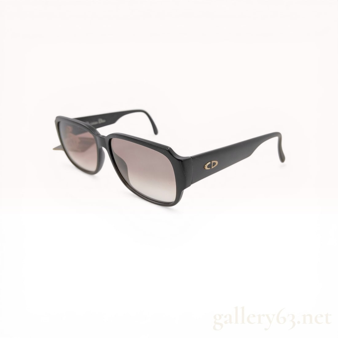 Christian Dior Model 2613 Black Optyl Sunglasses: Christian Dior model 2613 sunglasses, manufactured in Germany. The square frames are composed of black high-gloss Optyl featuring gradient-tinted lenses and gold-tone CD logo hardware on the temples. 