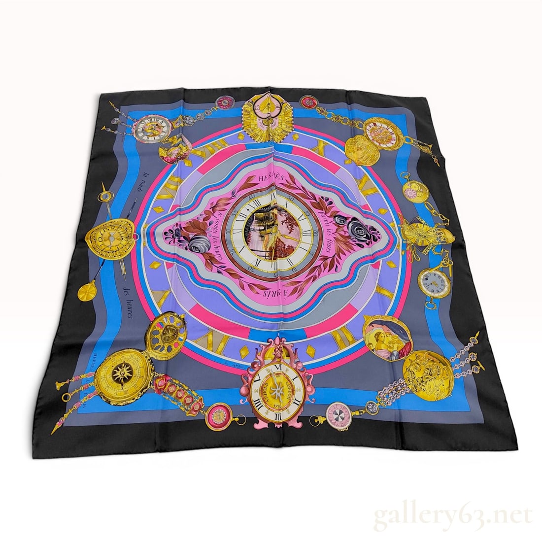 Hermes La Ronde des Heures Silk Scarf by Loic Dubigeon with Box: An Hermes silk twill square scarf featuring the La Ronde des Heures pattern designed by artist Loic Dubigeon. The design showcases an intricate horological theme with various antique-style pocket watc