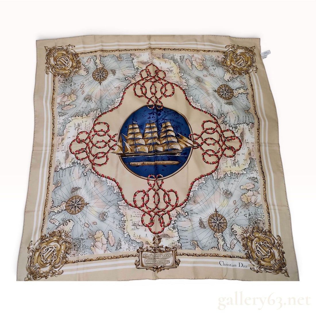 Christian Dior Nautical Maritime Theme Silk Scarf: A vintage Christian Dior square scarf made of 100 percent silk featuring an intricate nautical and maritime design. The composition centers on a circular medallion depicting a three-masted sailing shi