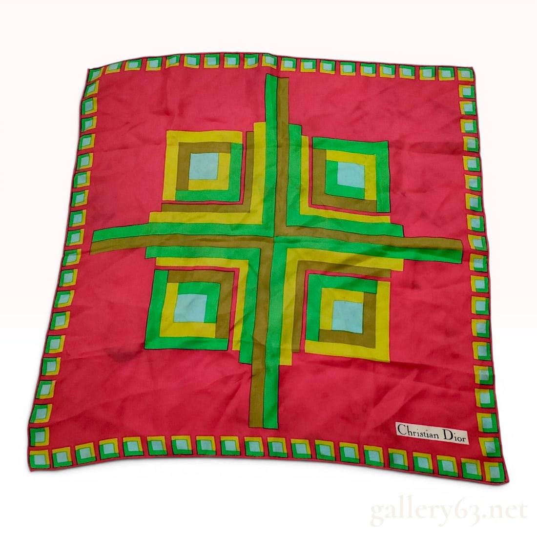 Christian Dior Vintage Silk Geometric Pattern Scarf: A vintage square silk scarf by Christian Dior featuring a bold modernist Op-Art geometric design. The central composition consists of four quadrants of nested squares in shades of emerald green, lime 