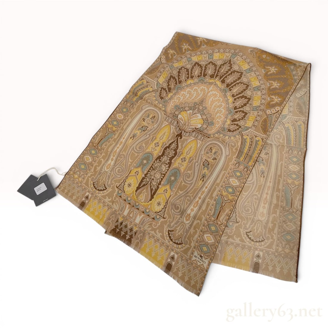 Etro Milano Wool and Silk Paisley Scarf: A designer scarf by Etro Milano featuring a complex, multi-colored paisley and floral medallion design. The color palette is composed of earthy tones including shades of brown, tan, and ochre, accente