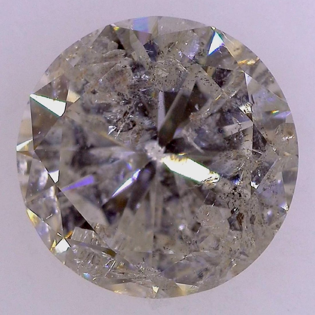Round Brilliant Cut Natural Diamond, 2.227 Carats, CGL Certified: This round brilliant cut natural diamond is accompanied by a Central Gem Laboratory (CGL) report, number O2421201. The stone is graded as J color with I-2 clarity and a Fair cut grade. No fluorescence
