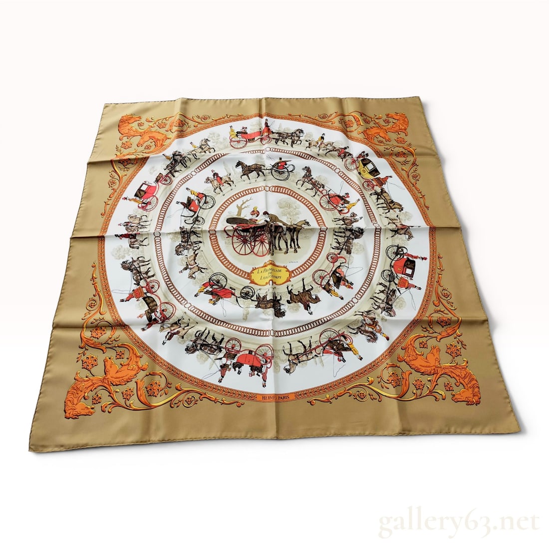 Hermes La Promenade de Longchamps Silk Scarf by Philippe Ledoux with Box: This silk scarf is produced by Hermes and features the La Promenade de Longchamps design by artist Philippe Ledoux. The composition is arranged in concentric circular bands, illustrating various horse