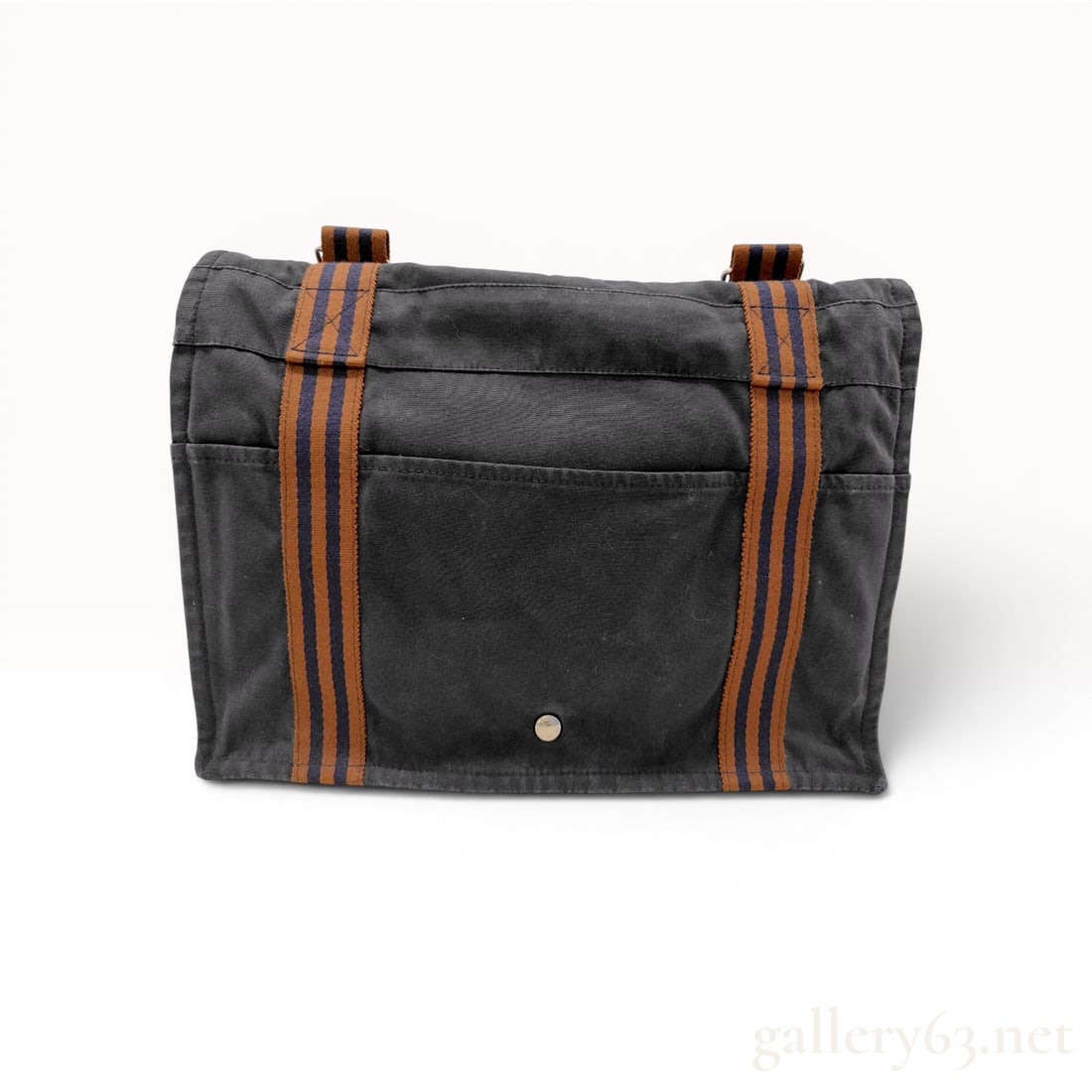 Hermes Fourre-Tout Canvas Messenger Bag: Hermes canvas messenger bag featuring a heavy-weight navy blue canvas body with woven webbing shoulder straps and accents in a brown and navy blue striped pattern. The bag is designed with a large fro