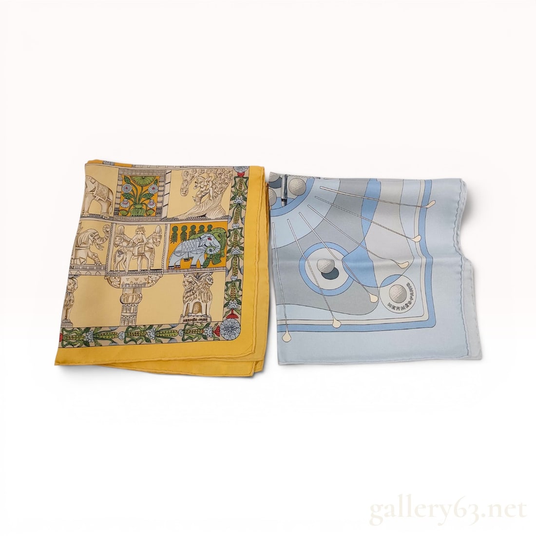 Two Hermes Silk Pocket Squares Including Torana Pattern: This lot consists of two vintage Hermes 100 percent silk pocket squares, also referred to as gavroches, characterized by the brand's signature hand-rolled hems. The first square features the Torana pa