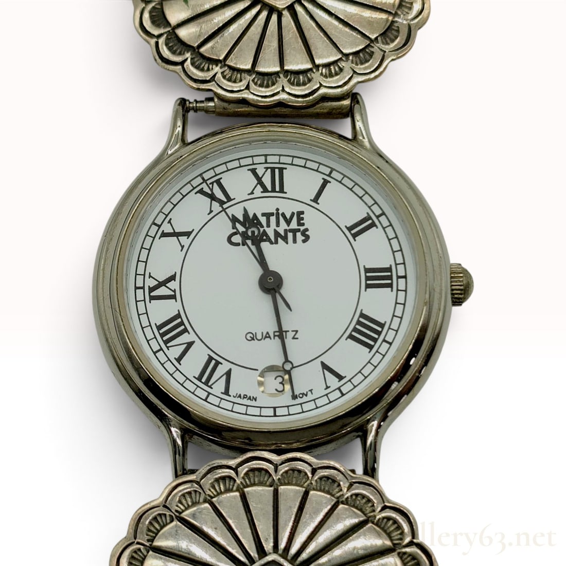 Navajo El Tom Sterling Silver Concho Bracelet Watch: A ladies Southwestern-style timepiece featuring a handcrafted sterling silver concho link bracelet by Navajo artist El Tom. The bracelet consists of scalloped concho links with stamped rayed designs a
