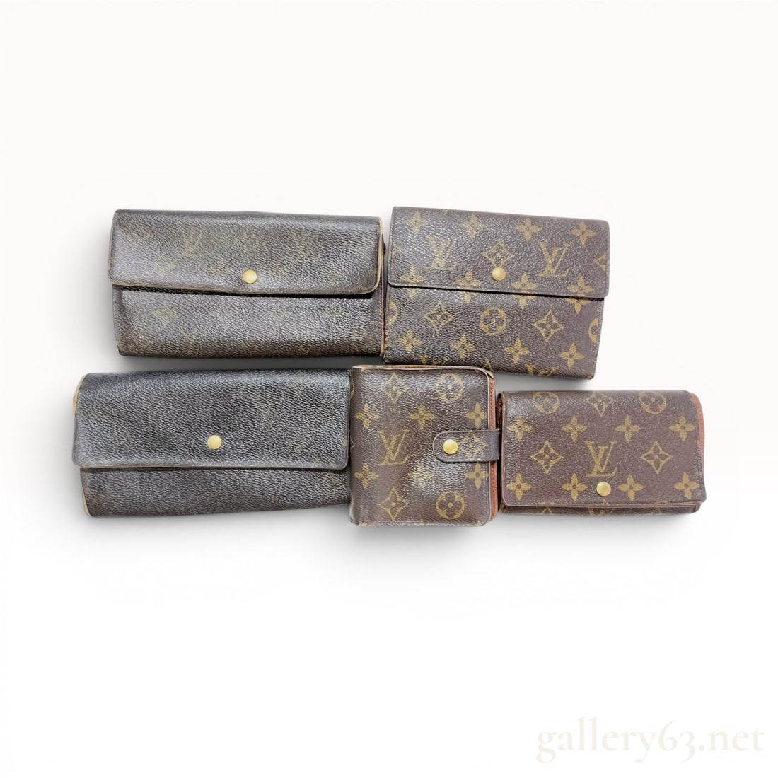 A Collection of Five Louis Vuitton Monogram Coated Canvas Wallets (1 of 10)
