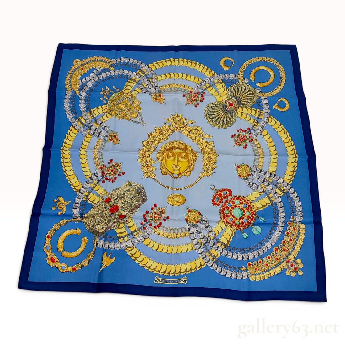 Hermes Kosmima Silk Scarf Designed by Julia Abadie: This Hermes 90cm silk twill scarf features the Kosmima pattern designed by artist Julia Abadie. The design is centered on a gold-tone Hellenistic head encircled by a laurel wreath. The field displays 