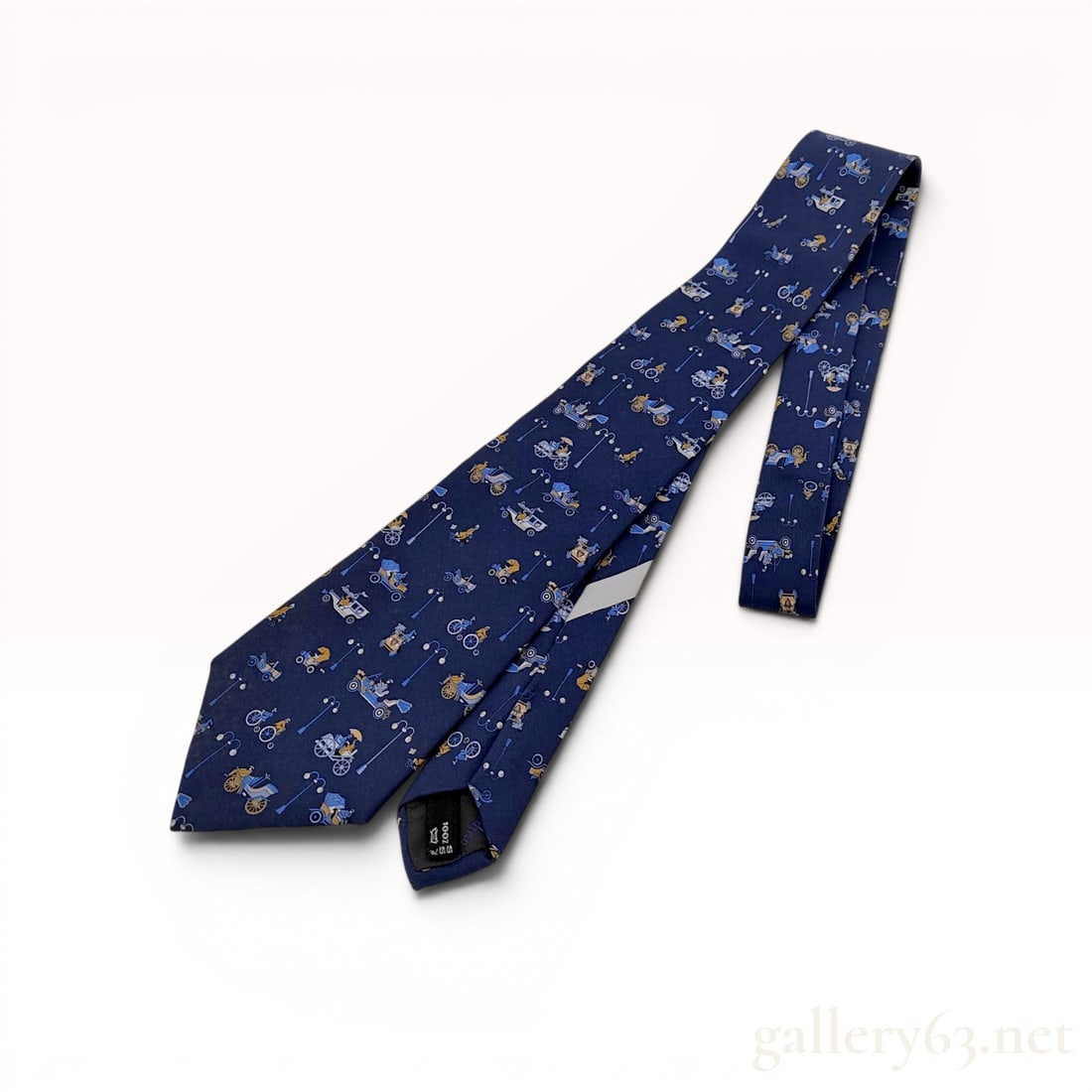 Salvatore Ferragamo Italian Silk Vintage Transportation Novelty Necktie: This Salvatore Ferragamo silk necktie features an all-over whimsical novelty print of vintage transportation motifs set against a navy blue ground. The pattern includes detailed illustrations of antiq