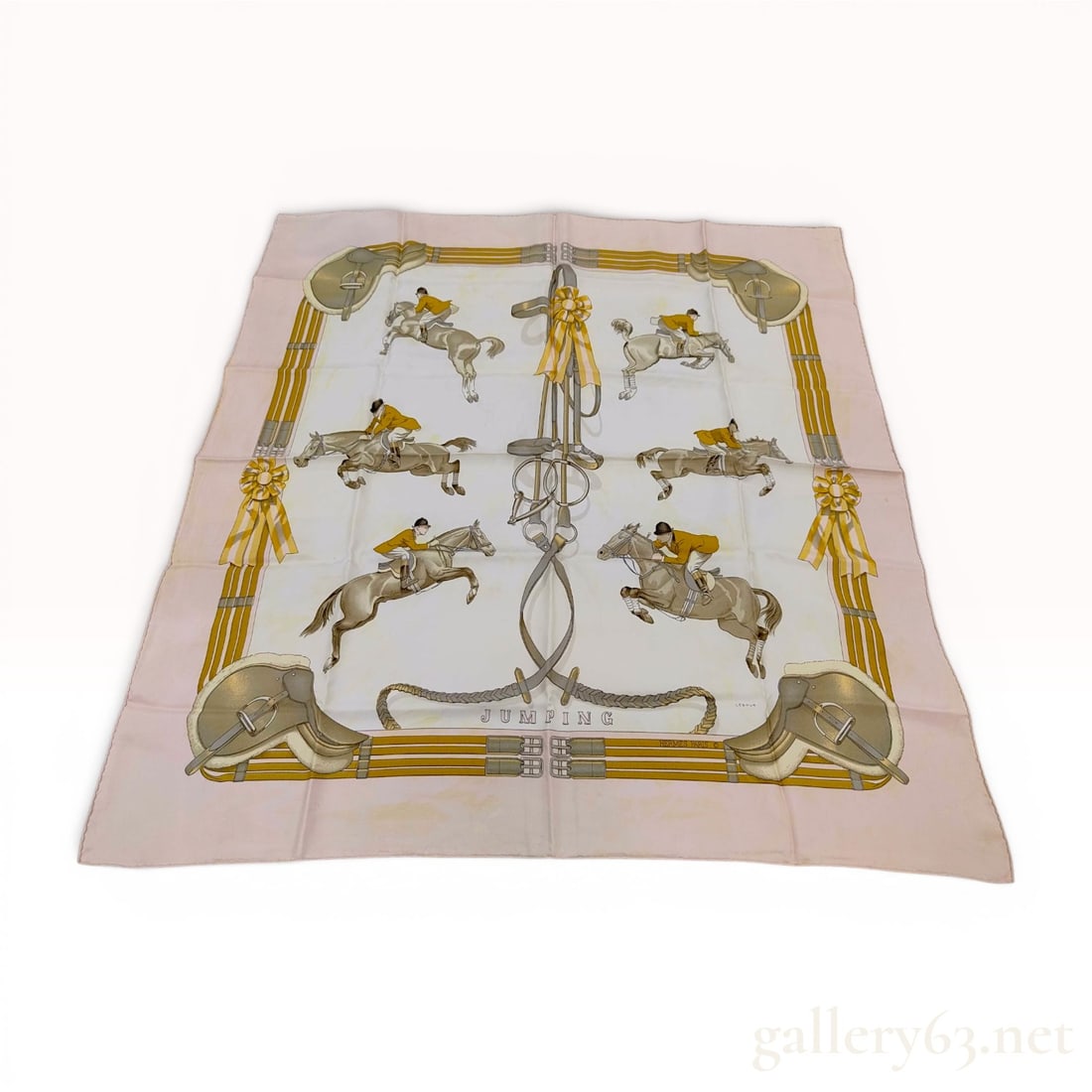 Hermes Jumping Pattern Silk Scarf by Philippe Ledoux: A vintage silk scarf by Hermes titled Jumping and designed by Philippe Ledoux. This Carre 90 scarf features an equestrian theme with several vignettes depicting horses and riders performing jumps. The